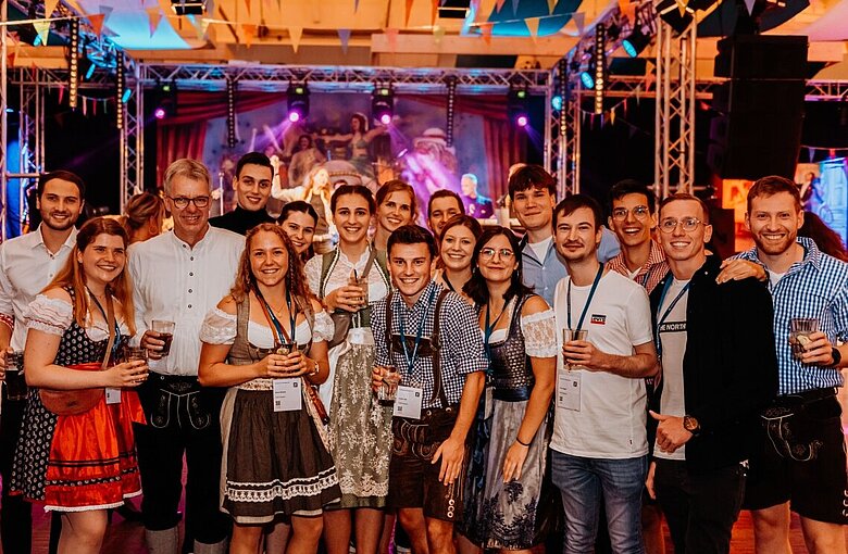 The photo shows Institute Director Prof. Jörn Peter Lass in the circle of students from Mosbach University of Applied Sciences at the "Circus Party" of the Rosenheim Window and Facade conference  (Source: ift Rosenheim/Anton Zaharkov, Knipser Photography)