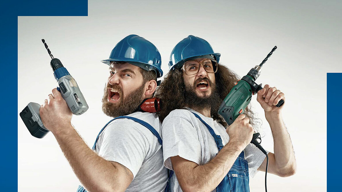 Fyler mit Foto, auf dem zwei Männer in Arbeitskleidung und mit Bohrmaschinen in der Hand stehen