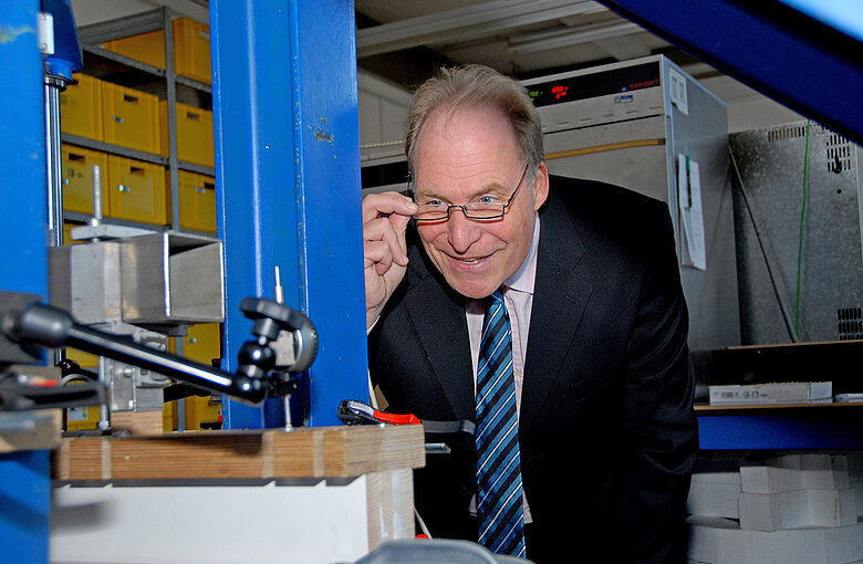 Prof. Ulrich Sieberath looks at something with a smile